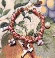 Candy-Girl Charm Bracelet: Pink-Woven with metal alloy charms